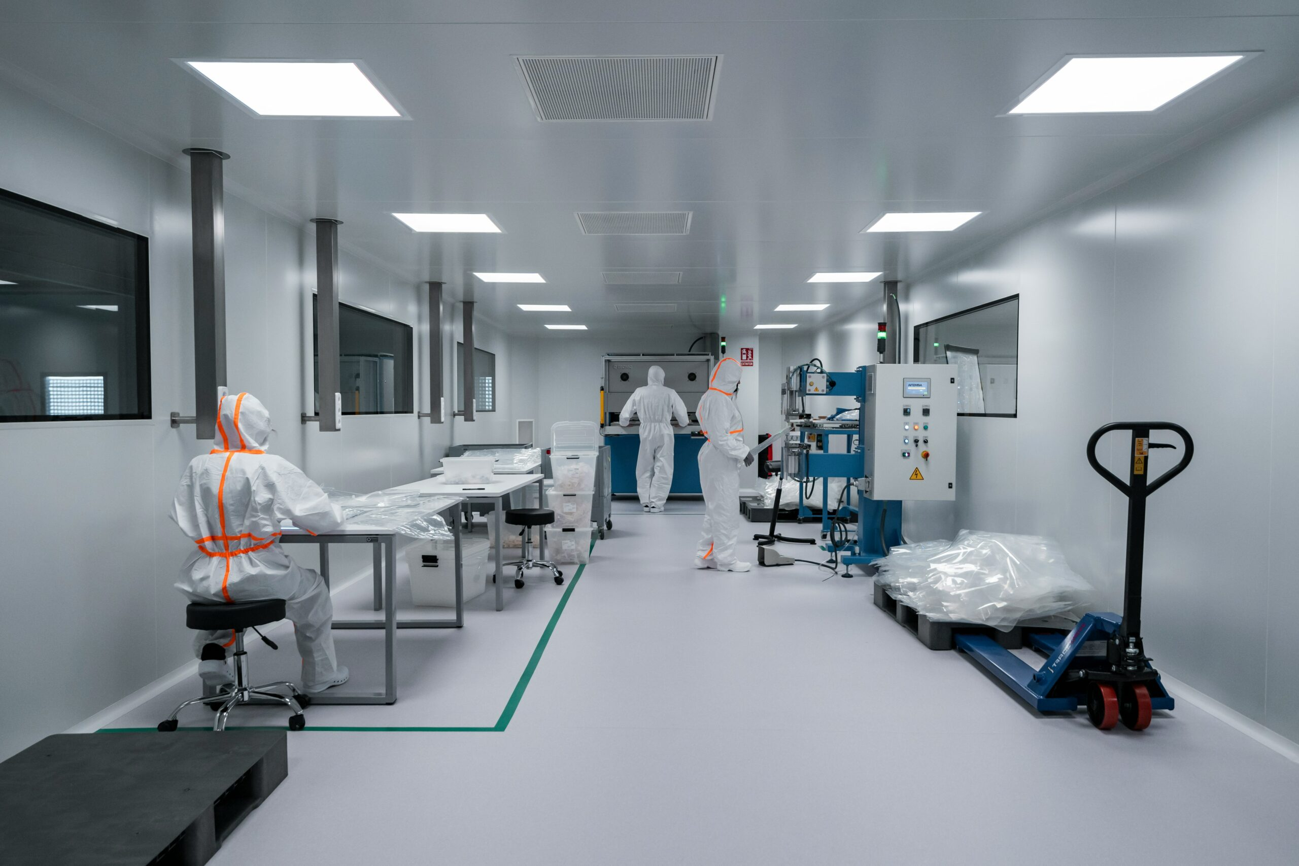 Technicians installing cleanroom panels and HVAC systems